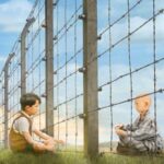 Il bambino con il pigiama a righe